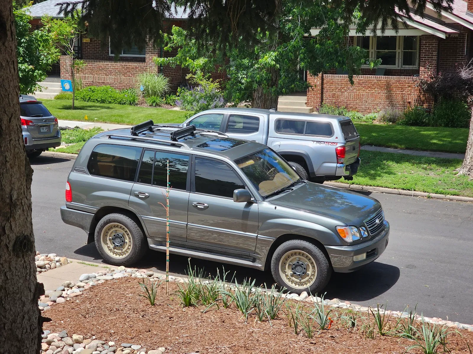 A gray Lexus SUV back on a Lakewood street after service