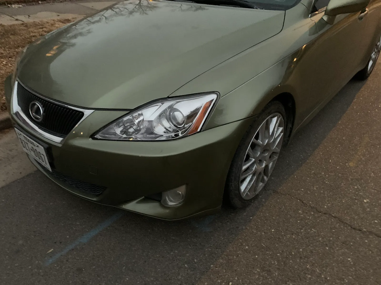 Front quarter of an olive-green Lexus sedan after service